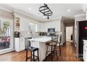 Bright kitchen featuring white cabinets, center island, and stainless steel appliances at 420 Woodlark Ct, Indian Trail, NC 28079