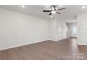 Bright, open living room with wood-look floors, fresh white walls, and ample space for entertaining at 508 Maddox Dr, Shelby, NC 28152