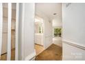 Inviting entryway leads to an open floorplan and bright kitchen, showcasing the home's flow at 5301 Amity Springs Dr, Charlotte, NC 28212