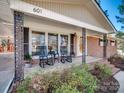 Inviting front porch with rocking chairs and decorative iron columns at 601 Wilmar Nw St, Concord, NC 28025