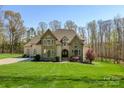 Traditional home boasting a manicured lawn, stone accents, and a welcoming entrance at 2017 Colorado Ct, Lancaster, SC 29720