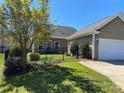 View of the fenced back yard and connecting garage at 353 Montibello Dr, Mooresville, NC 28117