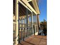 Enclosed porch featuring an expansive view and railing overlooking calm waters at 141 Sunrise Pt, New London, NC 28127