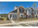 Charming townhome with brick and siding exterior and well-maintained landscaping at 1111 Johns Walk Way, Belmont, NC 28012