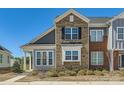 Attractive townhome featuring brick and siding, and sidewalk at 1111 Johns Walk Way, Belmont, NC 28012