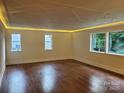 Spacious living room is bright with natural light and has a decorative ceiling at 317 Belwood Dr, Belmont, NC 28012