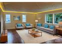 Bright living room features hardwood floors, a plush rug, and recessed lighting at 317 Belwood Dr, Belmont, NC 28012