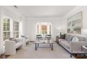 Cozy living room with bay window, neutral tones, and comfortable seating arrangement at 7605 Berryfield Ct, Waxhaw, NC 28173