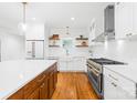 Well-appointed kitchen with stainless steel appliances, a farmhouse sink and floating shelves at 170 Della Dr, Statesville, NC 28625