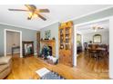 Spacious living room features hardwood floors, a fireplace, and access to the dining area at 1912 Old West Ln, Gastonia, NC 28052