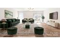 Spacious living room with modern decor, plush seating, and lots of natural light at 2116 Wilson Ave, Monroe, NC 28110