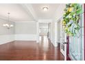 Spacious foyer with hardwood floors, white trim, and an open view into the formal living and dining areas at 1034 Currituck Way, York, SC 29745