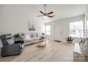 Cozy living room with ceiling fan, plush seating, and natural light at 104 S Canyon Rdg, Mount Holly, NC 28120