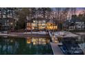 Beautiful waterfront property with private beach, dock, outdoor seating, and expansive lake views at 111 Moors End Loop, Mooresville, NC 28117