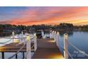 Scenic lake view from the private dock, perfect for boating and enjoying the sunset with lounge chairs at 111 Moors End Loop, Mooresville, NC 28117