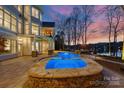 Gorgeous backyard pool and patio area, perfect for relaxing and entertaining with scenic views at 111 Moors End Loop, Mooresville, NC 28117
