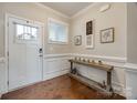 Well-lit foyer with hardwood floors, decorative molding, and stylish console table at 1211 Croft Dr, Fort Mill, SC 29708