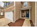 Inviting front entrance with a blue door, small porch, and well-maintained landscaping at 1211 Croft Dr, Fort Mill, SC 29708