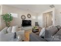 Comfortable living room featuring stylish decor, hardwood floors, and neutral colored walls at 126 Johns Cardinal Dr, Mooresville, NC 28115