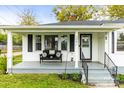 Inviting front porch with seating and a view of the landscaped yard, enhancing curb appeal at 1301 Jackson St, Kannapolis, NC 28083