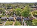 Aerial view showcases the home's location within a lush, green neighborhood near the city skyline at 1814 Eastway Dr, Charlotte, NC 28205