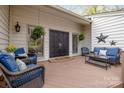 Inviting front porch seating area with stylish furnishings, creating a cozy outdoor living space at 27 Heritage Ct, Lake Wylie, SC 29710