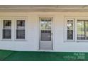 Charming porch with white exterior and multiple windows at 28120 Ryan Rd, Richfield, NC 28137