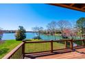 Expansive lake view from the wooden deck, showcasing the beautiful waterfront scenery at 343 River Haven Dr, Taylorsville, NC 28681