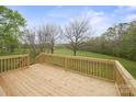 Enjoy the beauty of nature from this elevated, newly constructed, wooden deck overlooking the rear yard at 450 Tot Dellinger Rd, Cherryville, NC 28021