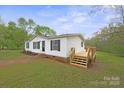 A charming single-story home with a newly constructed wooden deck and steps at 450 Tot Dellinger Rd, Cherryville, NC 28021