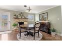Cozy dining room with a round table, fireplace, and elegant decor at 5467 Whiting Ave, Kannapolis, NC 28083