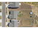 Aerial view of a home showcasing the backyard with a trampoline and approximate property lines at 650 Scotch Meadows Loop, Monroe, NC 28110