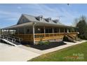 Attractive home with a large wraparound porch and ramp for easy access, enhancing accessibility at 7780 Stokes Ferry Rd, Salisbury, NC 28146