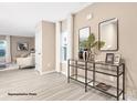 Light-filled foyer with neutral walls, light wood floors, and a decorative console table at 1036 Hostler Ln, York, SC 29745