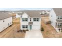 Aerial view of a charming home featuring well-maintained landscaping, driveway, and a welcoming facade at 111 Buoy Ln # 392, Statesville, NC 28677