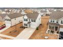 Aerial view showcasing a house with a spacious driveway and pristine lawn in a residential neighborhood at 111 Buoy Ln # 392, Statesville, NC 28677