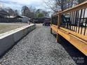 RV community with golf cart, cottage, and gravel at 120 Cherokee Trl, Mount Gilead, NC 27306