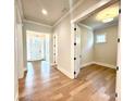 Open foyer with hardwood floors, offering views into other rooms at 174 Fulworth Nw Dr # 65, Concord, NC 28027