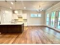 Open concept kitchen boasting an island with granite countertops and stainless steel appliances at 178 Fulworth Nw Dr # 64, Concord, NC 28027