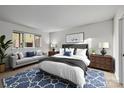Inviting bedroom with a large window and a comfortable bed and stylish furniture at 1832 J Julian Ln # D, Charlotte, NC 28208