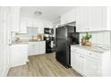Modern kitchen with white cabinets, stainless steel appliances, and granite countertops at 1905 Wood St, Gastonia, NC 28052