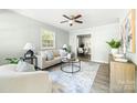 Bright living room with neutral paint, plenty of natural light, and hardwood flooring at 1905 Wood St, Gastonia, NC 28052