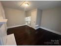 Bedroom showcasing hardwood floors, fresh paint, and natural light at 2300 Olando St, Charlotte, NC 28206