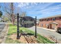 Elegant Cranbrook sign with manicured landscaping in front of brick apartments at 2629 Vail Ave, Charlotte, NC 28204