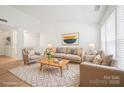 Spacious living room with bright natural light, neutral decor, and hardwood floors at 5291 Moonlight Sw Trl, Concord, NC 28025