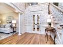Grand foyer with a staircase, decorative wallpaper, and white trim at 5419 Sunningdale Dr, Charlotte, NC 28277