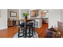 Cozy dining area with modern table and barstool seating, perfect for casual dining and entertaining at 9709 Emerald Point Dr # 6, Charlotte, NC 28278