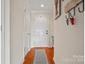 Welcoming foyer with hardwood floors and neutral walls, creating a bright and inviting entry at 9709 Emerald Point Dr # 6, Charlotte, NC 28278