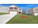 Charming two-story home with a well-maintained lawn and attached two-car garage at 1054 Horizon Ln, Chester, SC 29706