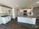 Charming kitchen with granite countertops, modern appliances, and a large island at 1054 Horizon Ln, Chester, SC 29706